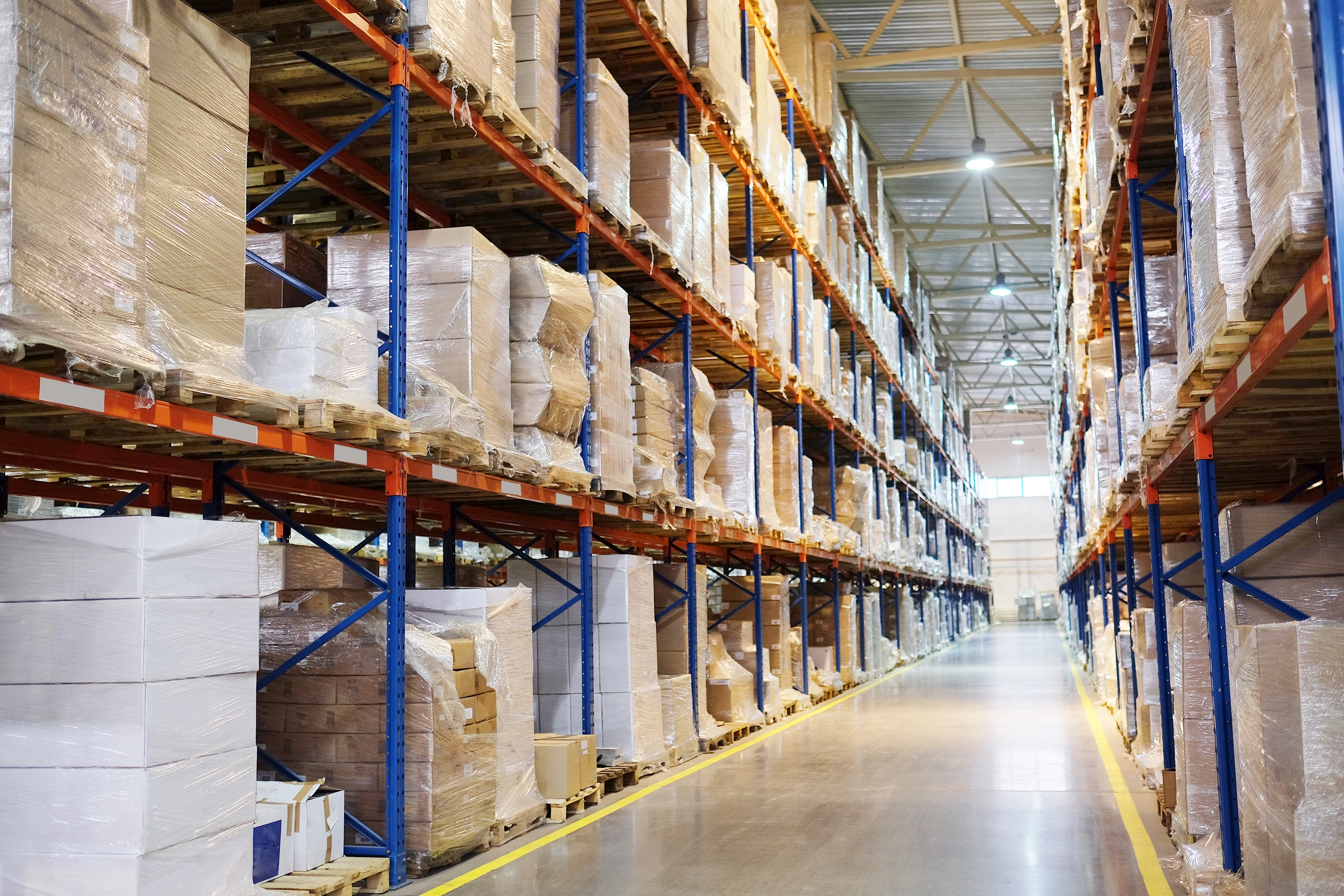 Warehouse storage with organized rows of boxes on shelves.