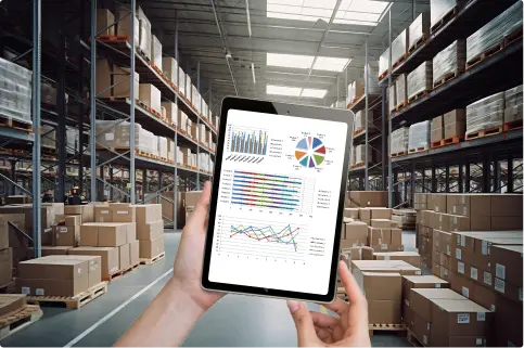 An operator using a tablet to check productivity through dashboards in a warehouse.